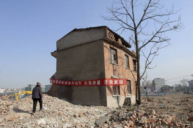 Τα σπίτια που στέκονται εμπόδια στην ανάπτυξη της Κίνας - Εικόνα 13
